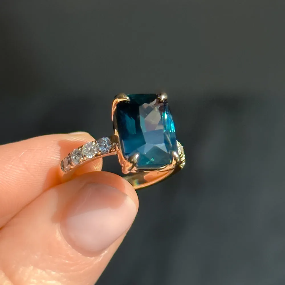 6.12ct Deep Teal Blue Madagascar Radiant Cut Sapphire Solitaire Ring with French Set Diamonds in 18k Yellow Gold