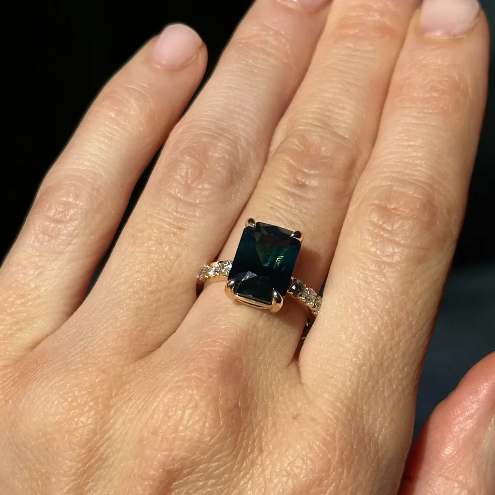 6.12ct Deep Teal Blue Madagascar Radiant Cut Sapphire Solitaire Ring with French Set Diamonds in 18k Yellow Gold