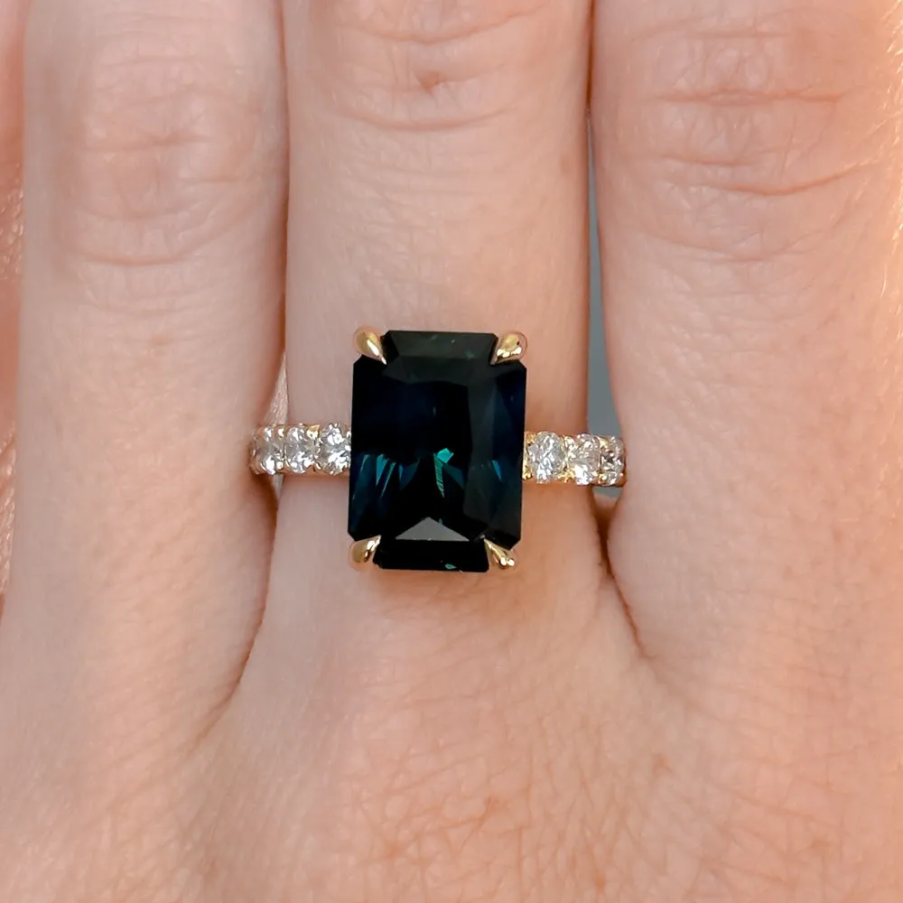 6.12ct Deep Teal Blue Madagascar Radiant Cut Sapphire Solitaire Ring with French Set Diamonds in 18k Yellow Gold