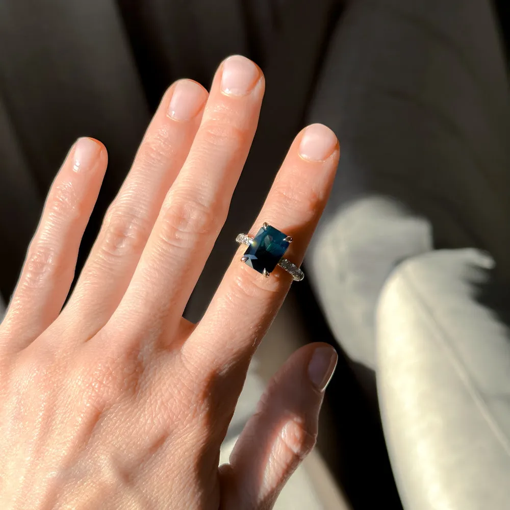 6.12ct Deep Teal Blue Madagascar Radiant Cut Sapphire Solitaire Ring with French Set Diamonds in 18k Yellow Gold